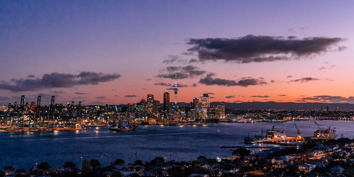 Auckland city skyline across the harbour at twilight