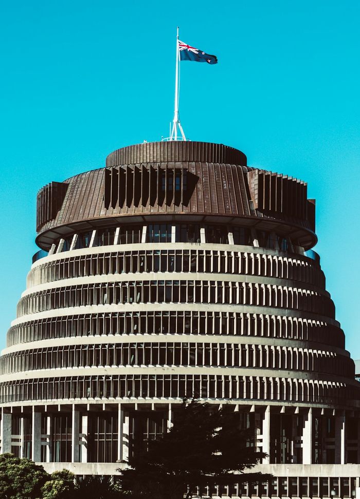 The Beehive parliament building in Wellington under a blue sky
