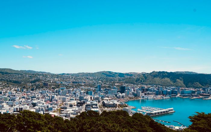 Wellington city and harbour under a clear blue sky
